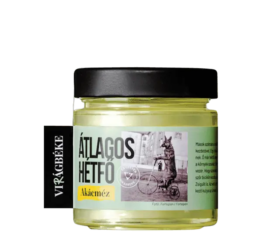 Virágbéke "Átlagos hétfő" akácméze látható, a méz színe szép, aranyszínű sárga. A kupak fekete. 