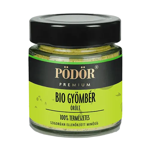Pödör prémium gyömbér üvegbezárva. Az üvegben látszik az őrölt gyömbér. A címke színe zöld és fekete, a "Bio gyömbér" felirat színe fekete. 