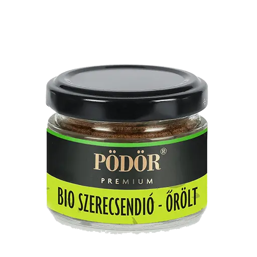 Pödör bio szerecsendió látható üvegbe zárva. látható az üvegen keresztül az őrölt szerecsendió is. A címke színe fekete és zöld, a Pödör prémium felirat arany színű.